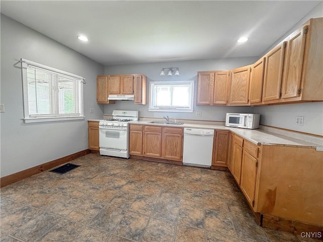 73 Groton Ave Unit 69-71, Cortland, NY 13045 - kitchen with white appliances, under cabinet range hood, light countertops, recessed lighting, and dark stone finish flooring