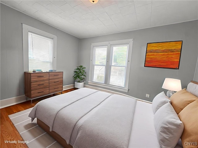 73 Groton Ave Unit 69-71, Cortland, NY 13045 - bedroom featuring dark wood-style flooring and baseboards