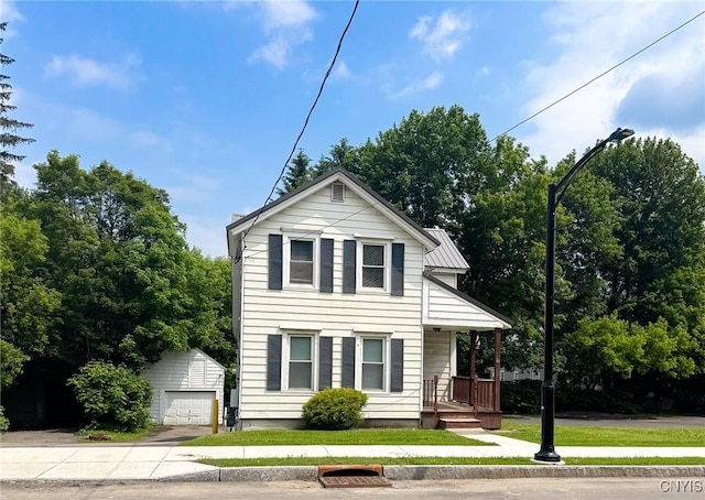 66 Groton Ave, Cortland, NY 13045 - view of front of property with an outbuilding, driveway, a porch, and a detached garage