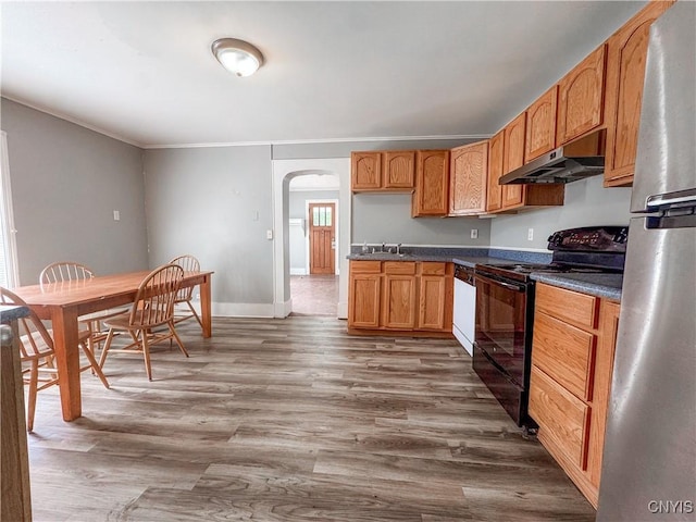 66 Groton Ave, Cortland, NY 13045 - kitchen with black / electric stove, under cabinet range hood, freestanding refrigerator, arched walkways, and dark wood-type flooring
