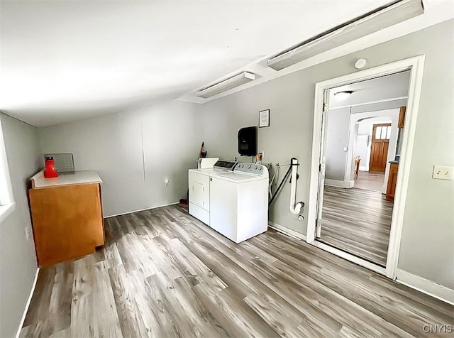 66 Groton Ave, Cortland, NY 13045 - laundry room with washer and dryer, wood finished floors, and arched walkways