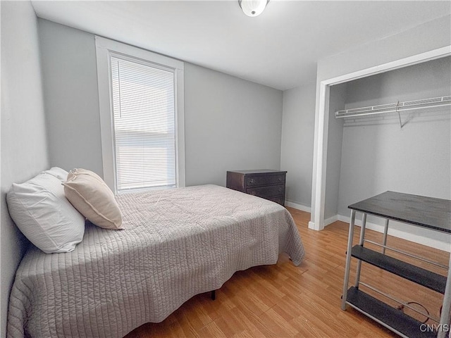 63 Groton Ave, Cortland, NY 13045 - bedroom with a closet and wood finished floors