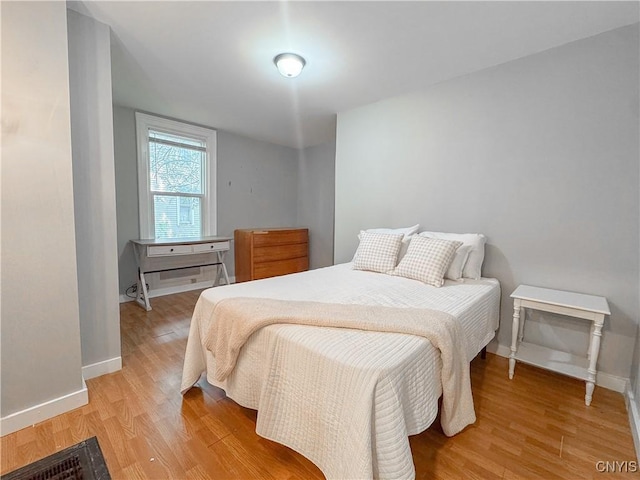63 Groton Ave, Cortland, NY 13045 - bedroom with light wood-style flooring and baseboards