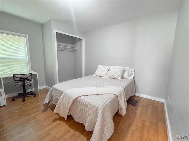 63 Groton Ave, Cortland, NY 13045 - bedroom with light wood-type flooring and a closet