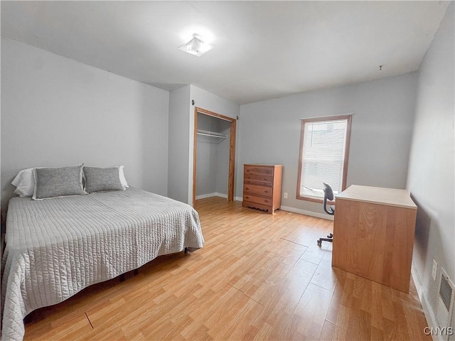 63 Groton Ave, Cortland, NY 13045 - bedroom with light wood-type flooring, a closet, and an office area