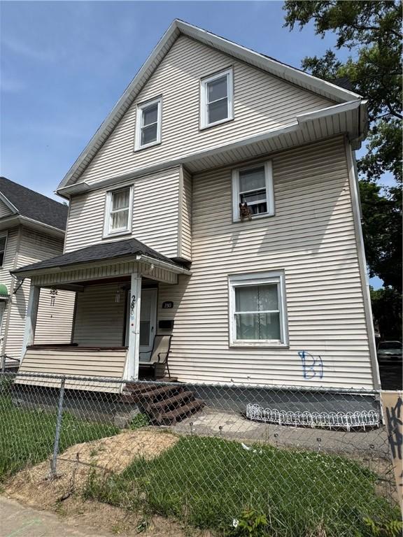 280 Ave D, Rochester, NY 14621 - view of front of home with a fenced front yard and covered porch