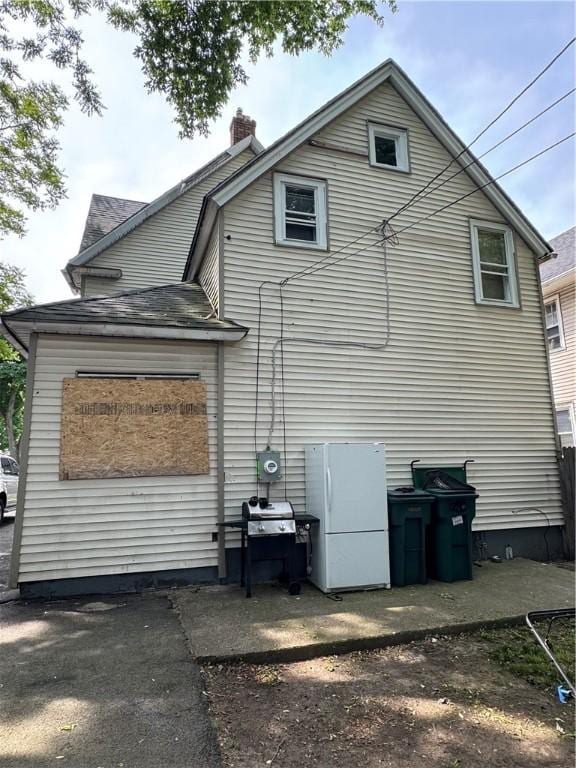 280 Ave D, Rochester, NY 14621 - view of home's exterior featuring a chimney