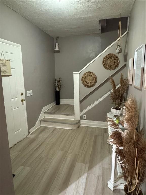 280 Ave D, Rochester, NY 14621 - hallway with a textured ceiling and wood finished floors