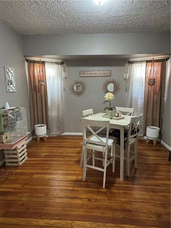 280 Ave D, Rochester, NY 14621 - dining area featuring hardwood / wood-style flooring and a textured ceiling