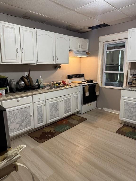 280 Ave D, Rochester, NY 14621 - kitchen featuring white electric range, under cabinet range hood, a paneled ceiling, white cabinets, and light wood finished floors