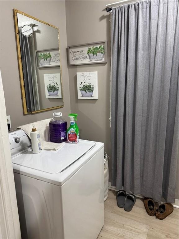 280 Ave D, Rochester, NY 14621 - laundry room with light wood-style flooring and washing machine and dryer