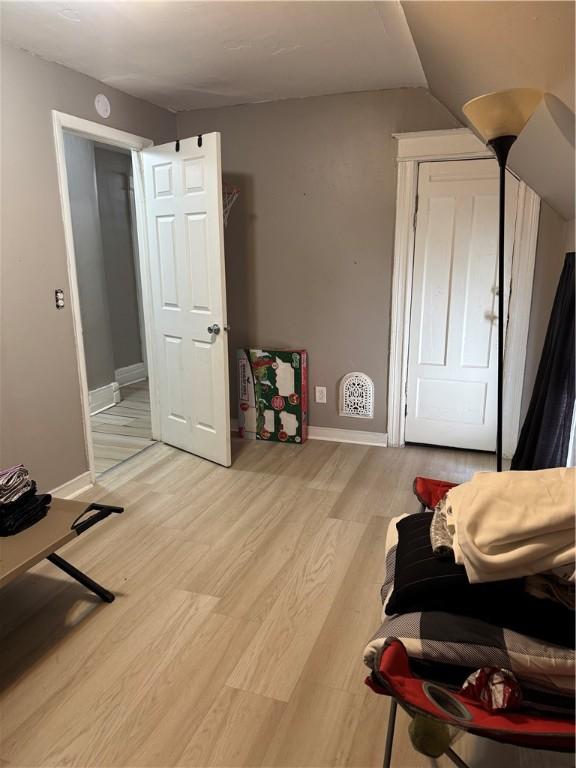 280 Ave D, Rochester, NY 14621 - sitting room featuring light wood-style flooring and lofted ceiling