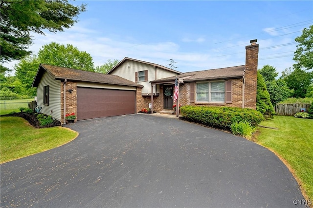 148 Dorando Way, Salina, NY 13090 - split level home featuring a chimney, an outbuilding, an attached garage, asphalt driveway, and brick siding