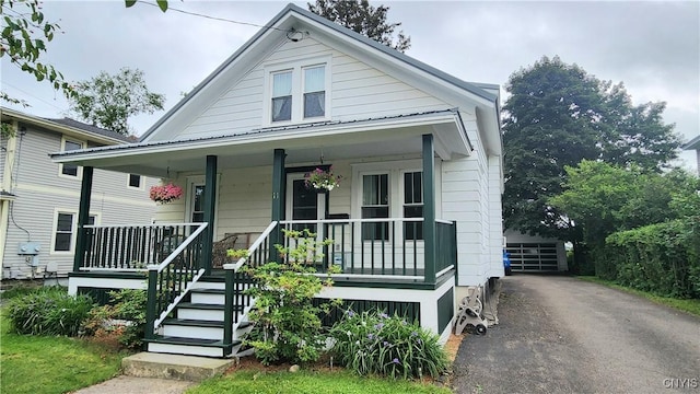 11 Randall St, Cortland, NY 13045 - bungalow-style house featuring a porch and a garage