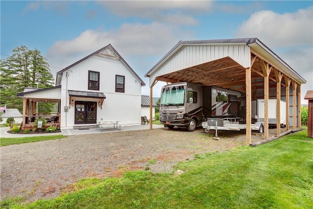 109 Unadilla Trail Rd, Pittsfield, NY 13411 - rear view of property with a carport, a lawn, and driveway