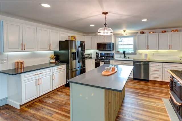 109 Unadilla Trail Rd, Pittsfield, NY 13411 - kitchen featuring stainless steel appliances, white cabinetry, dark countertops, recessed lighting, and wood finished floors