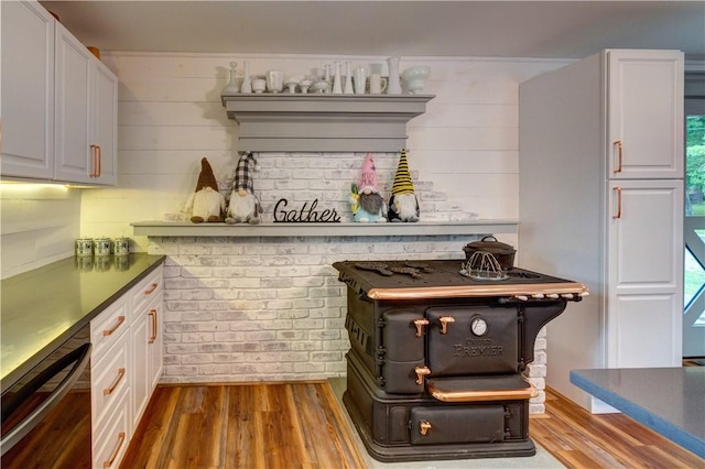 109 Unadilla Trail Rd, Pittsfield, NY 13411 - kitchen featuring wood finished floors, dishwashing machine, and white cabinetry