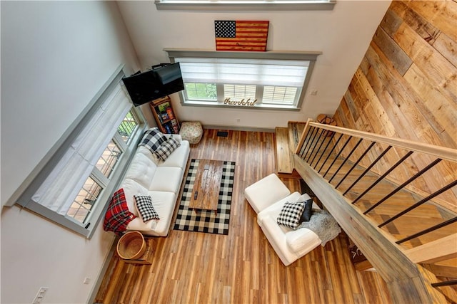 109 Unadilla Trail Rd, Pittsfield, NY 13411 - living room with a high ceiling, wood finished floors, and stairway