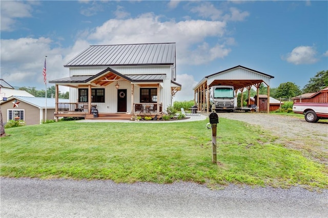 109 Unadilla Trail Rd, Pittsfield, NY 13411 - modern farmhouse with a porch, a carport, a standing seam roof, a front yard, and a metal roof