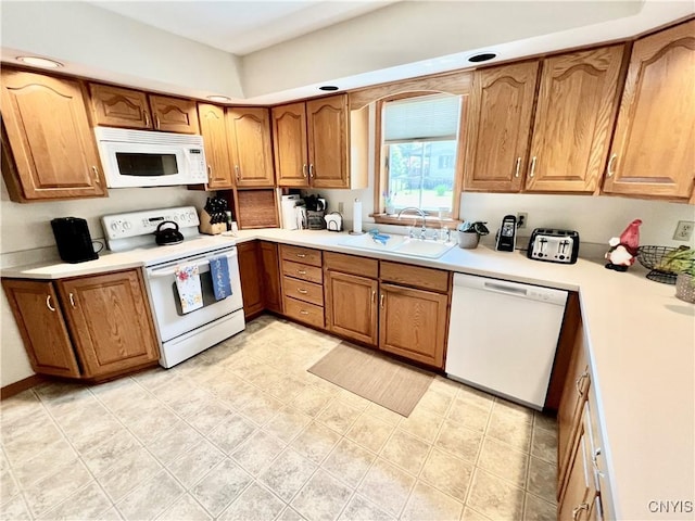 2 Whitetail Cir, Oswego-City, NY 13126 - kitchen with white appliances, brown cabinetry, light countertops, and light tile patterned flooring