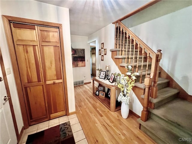 2 Whitetail Cir, Oswego-City, NY 13126 - entrance foyer with stairs and light wood-type flooring