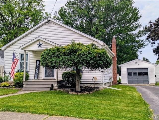 538 Seneca St, Oneida-Inside, NY 13421 - view of front facade featuring an outbuilding, a garage, a front lawn, and a chimney