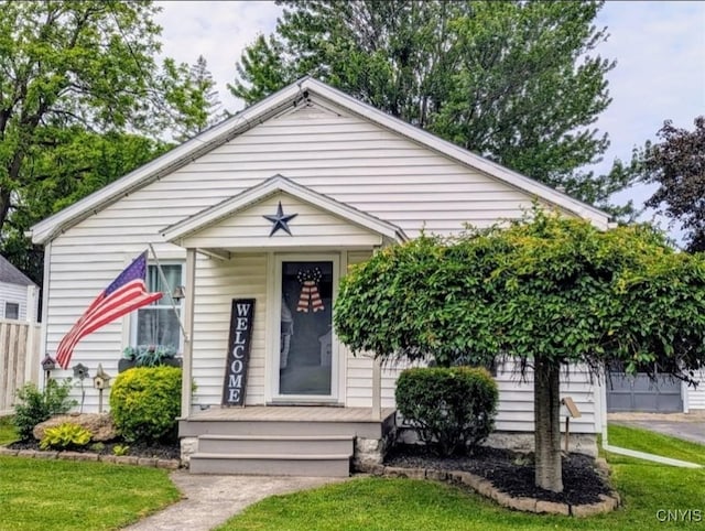 538 Seneca St, Oneida-Inside, NY 13421 - view of front of property with covered porch and a front yard