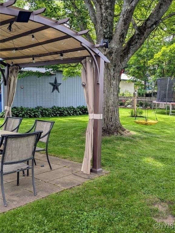 538 Seneca St, Oneida-Inside, NY 13421 - view of yard featuring a trampoline, a pergola, and a patio