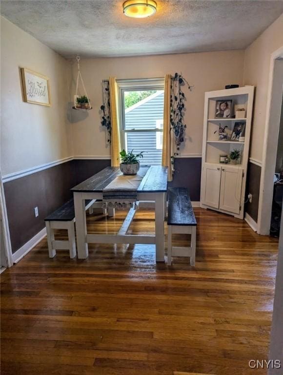 538 Seneca St, Oneida-Inside, NY 13421 - dining room with wood finished floors and a textured ceiling
