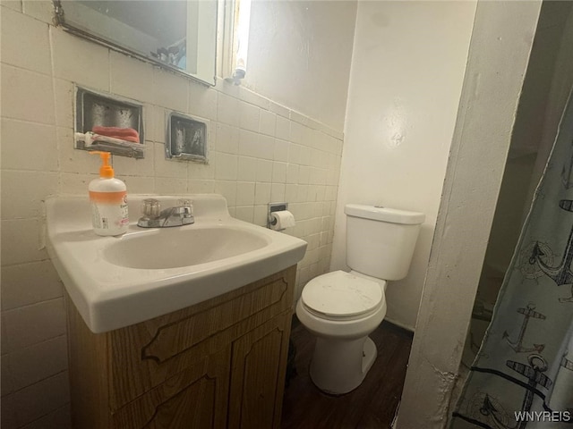 79 Freund St, Buffalo, NY 14215 - bathroom with vanity, wood finished floors, and a shower with curtain