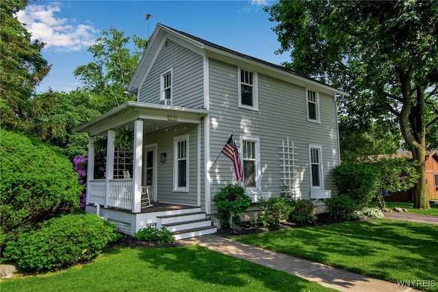 17 E Ave, Leroy, NY 14482 - view of front of property featuring covered porch and a front lawn