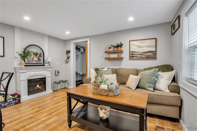 17 E Ave, Leroy, NY 14482 - living area featuring light wood-style floors, recessed lighting, and a glass covered fireplace