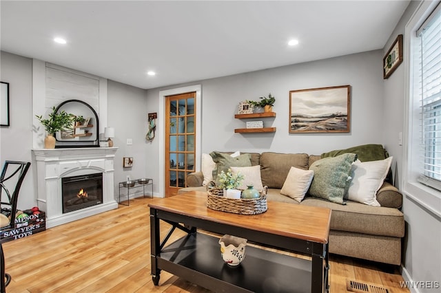 17 E Ave, Leroy, NY 14482 - living room with a glass covered fireplace, recessed lighting, and light wood-style flooring