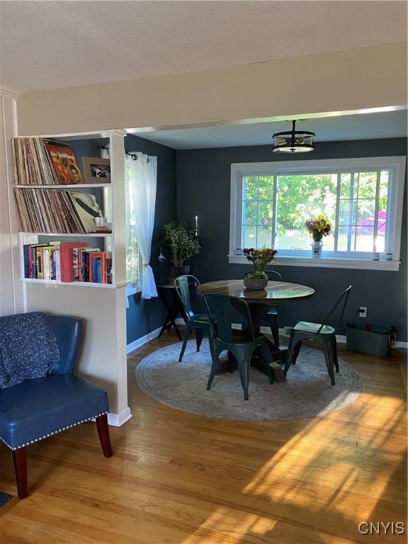 131 Wheaton Rd, Syracuse, NY 13203 - dining area with wood finished floors and a textured ceiling