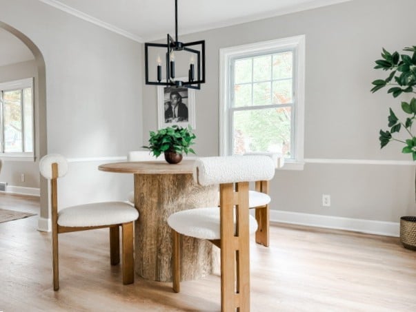 22 Yorkshire Rd, Irondequoit, NY 14609 - dining area featuring crown molding, arched walkways, light wood-type flooring, and a chandelier