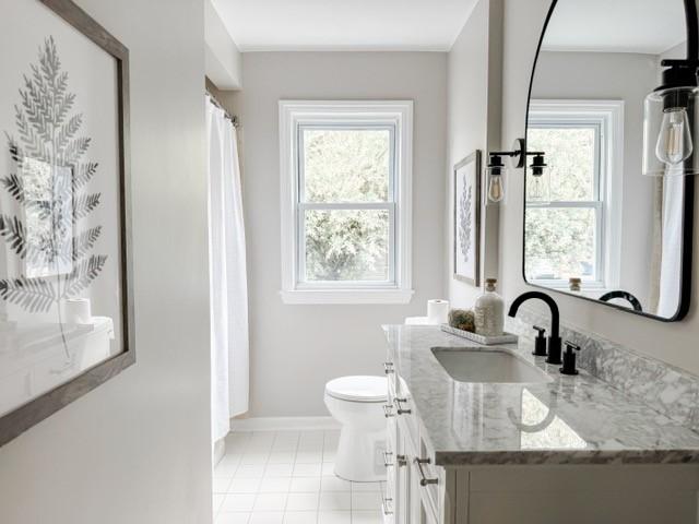 22 Yorkshire Rd, Irondequoit, NY 14609 - bathroom featuring vanity, healthy amount of natural light, tile patterned flooring, and a shower with shower curtain