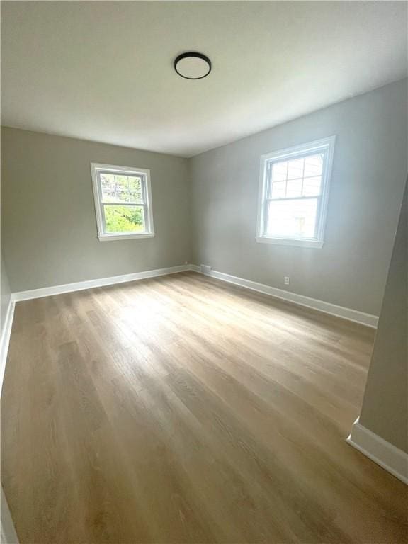22 Yorkshire Rd, Irondequoit, NY 14609 - unfurnished room featuring wood finished floors and baseboards