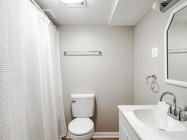 22 Yorkshire Rd, Irondequoit, NY 14609 - full bath with a textured ceiling, vanity, and a shower with shower curtain