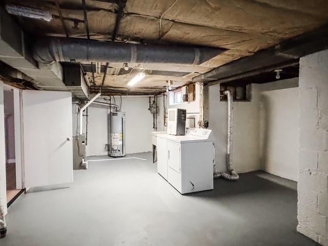 22 Yorkshire Rd, Irondequoit, NY 14609 - below grade area featuring water heater and washing machine and dryer