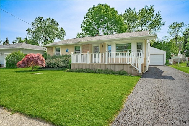 18 Eisenhower Dr, Lockport-City, NY 14094 - ranch-style house with covered porch, a front yard, a garage, and an outdoor structure