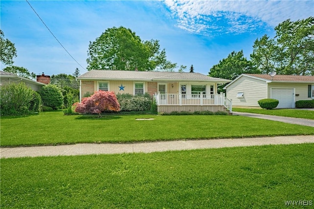 18 Eisenhower Dr, Lockport-City, NY 14094 - ranch-style home with a porch, a front yard, and driveway