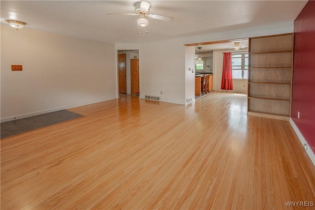18 Eisenhower Dr, Lockport-City, NY 14094 - empty room with ceiling fan and light wood-style floors