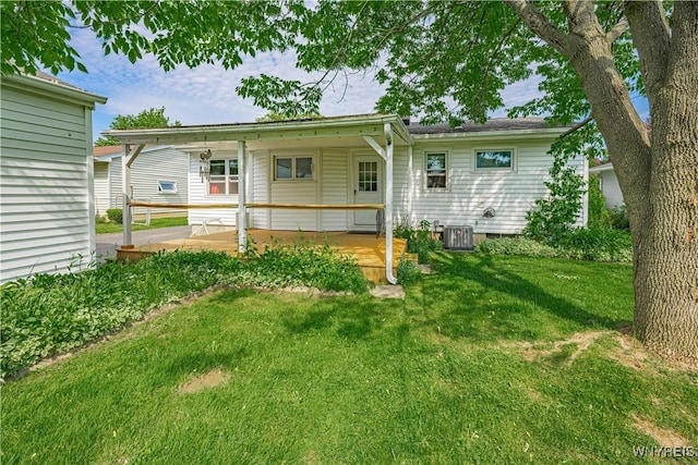 18 Eisenhower Dr, Lockport-City, NY 14094 - back of house featuring a lawn