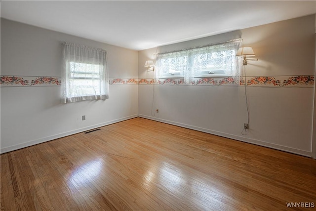 18 Eisenhower Dr, Lockport-City, NY 14094 - spare room featuring wood finished floors