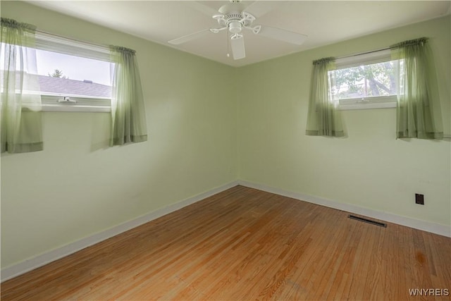 18 Eisenhower Dr, Lockport-City, NY 14094 - spare room featuring wood finished floors and a ceiling fan