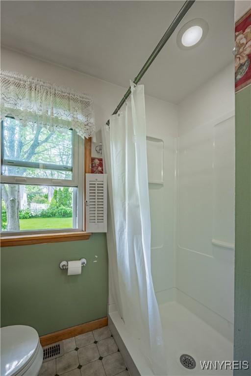 18 Eisenhower Dr, Lockport-City, NY 14094 - full bath with a shower stall and tile patterned flooring