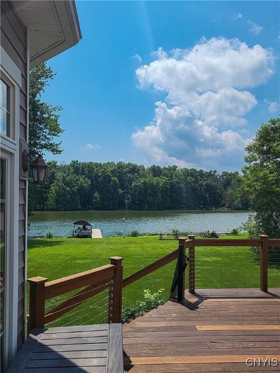 84 Krystyna Ln Unit 6, Cato, NY 13080 - deck featuring a water view, a lawn, and a view of trees