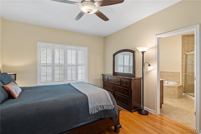 84 Krystyna Ln Unit 6, Cato, NY 13080 - bedroom with light wood-type flooring, ceiling fan, and ensuite bath