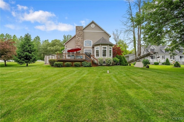 84 Krystyna Ln Unit 6, Cato, NY 13080 - back of property with a storage shed, a deck, a yard, and a chimney