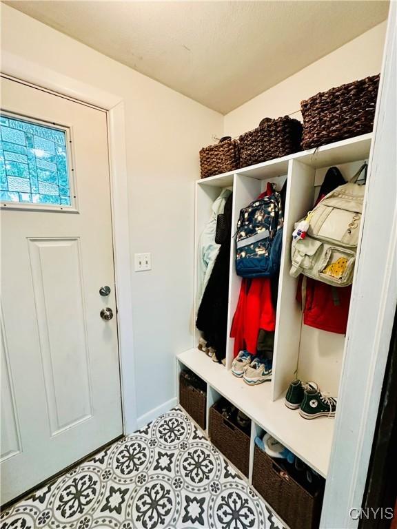 300 Hillsdale Ave, Syracuse, NY 13206 - mudroom with baseboards and tile patterned flooring
